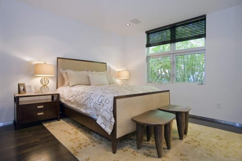 Tranquil Bedroom with full size beds, decorated with shades of browns and white.